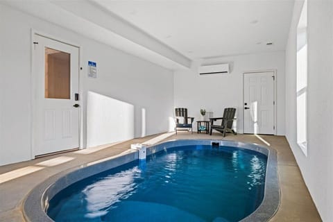 Your private indoor pool awaits, with poolside chairs and climate control for year-round relaxation.