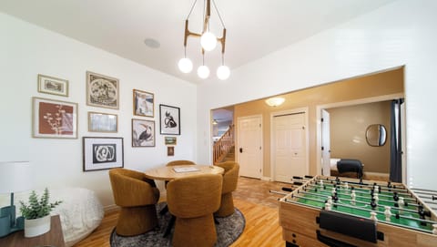 Inviting games area with round table, and foosball for group entertainment