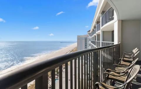 Sip morning coffee while waves sparkle along the shoreline.