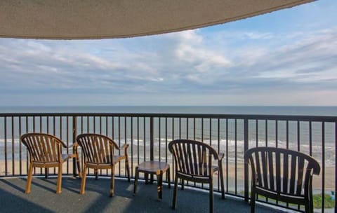 Sip morning coffee as waves roll beneath your balcony.