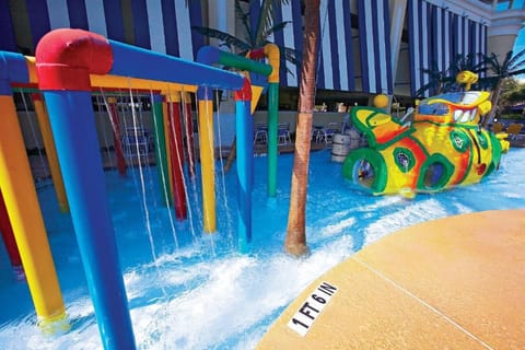 Let kids giggle through colorful splash zones and cool water.