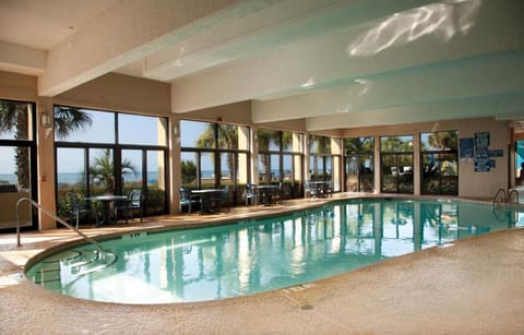 Float peacefully indoors with palm views through sunlit windows.
