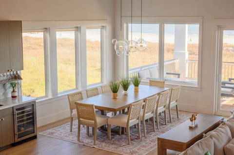 10-seat dining table is next to the wine/coffee bar