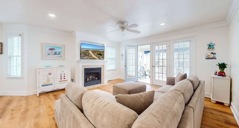 Living room area with fireplace and a flatscreen TV