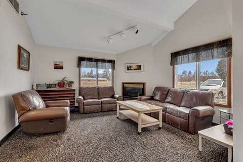 Cozy guest lounge with fireplace and comfortable seating.