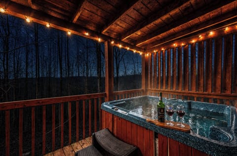 Enjoy your private hot tub under the patio lights