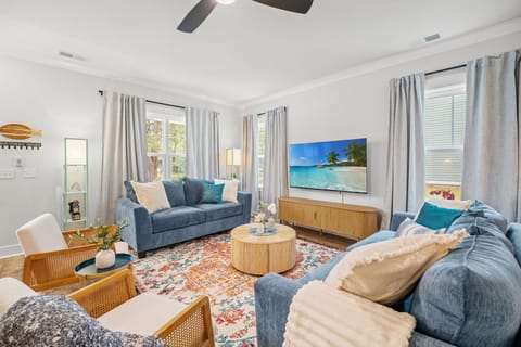 Cozy Living Room with a Smart TV, Lots of Seating, & Games for the Whole Family or Group to Enjoy