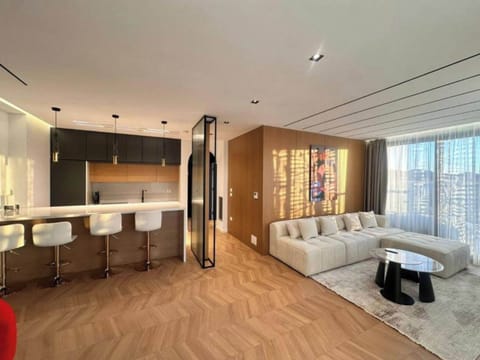 Apartment, Balcony, City View | Living area | 32-inch flat-screen TV with satellite channels