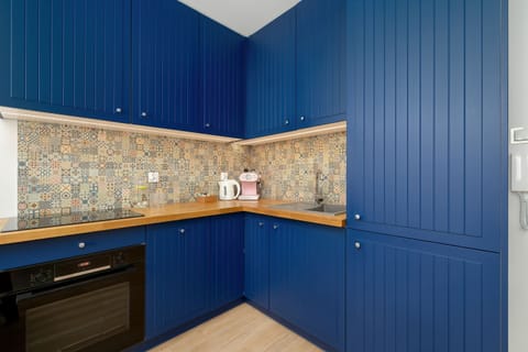 Functional kitchen corner with storage space and clean, modern layout.