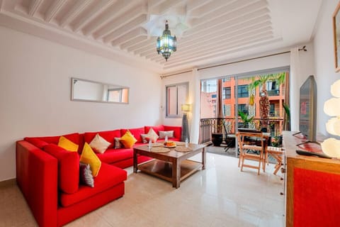 Relax in the stylish living room featuring elegant decor, a cozy sofa, and a smart TV for your entertainment.