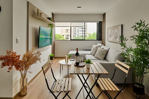 Basic Apartment | Living area | Flat-screen TV, computer monitors