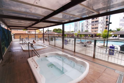 Outdoor pool, open 7:00 AM to 11:00 PM, pool umbrellas, sun loungers