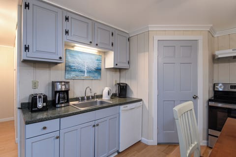 Cook, chat, and create memories in the cozy, lower level kitchen with all the tools and appliances you need.