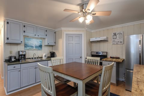 Your cozy kitchen invites memorable meals with warm wood accents, modern appliances, and plenty of space to cook and dine together.