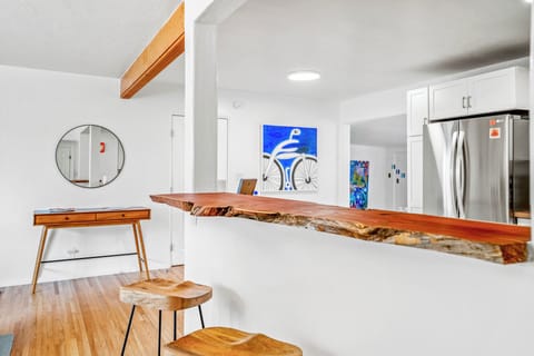 Breakfast bar connecting kitchen and living areas.