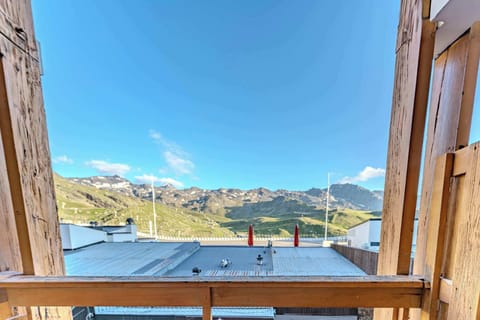 Step out onto your charming wooden balcony — soak in the fresh mountain air and majestic Val Thorens peaks.