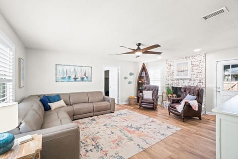 Spacious living area with sectional couch and chairs