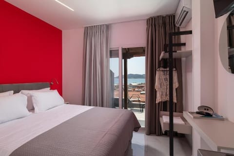 Double Bedroom with Balcony Door and Seating Area