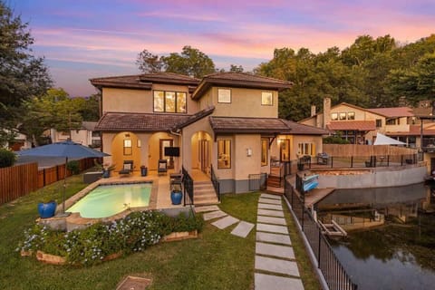 Unwind by the private pool and patio as the sun sets, with warm lighting, lounge seating, and easy access from the living room. A perfect space for relaxing evenings after a day on the lake.