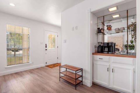 Start your mornings at the fully stocked coffee bar featuring both a drip machine and Keurig, plus mugs, filters, and essentials. Thoughtfully designed with open shelving and warm lighting, it’s the perfect spot to fuel up before exploring Austin.