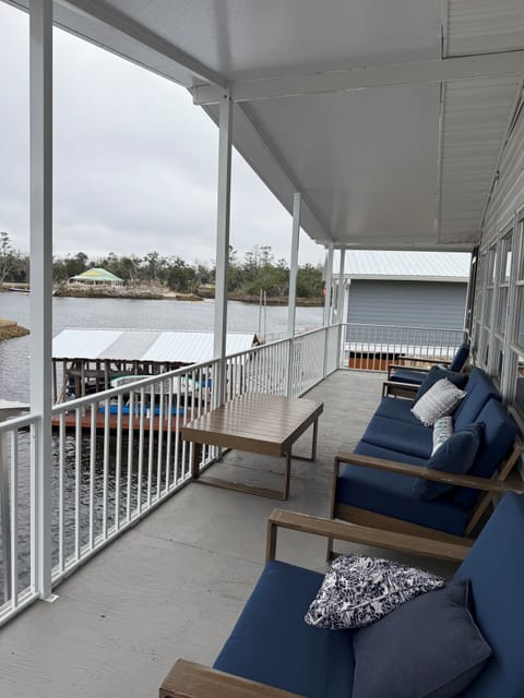 Peaceful views from the covered porch with a direct view of the canal and river.