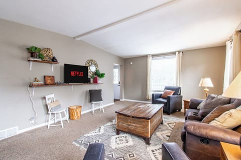 [Living room, main floor] Just inside the front entrance, the living room featur