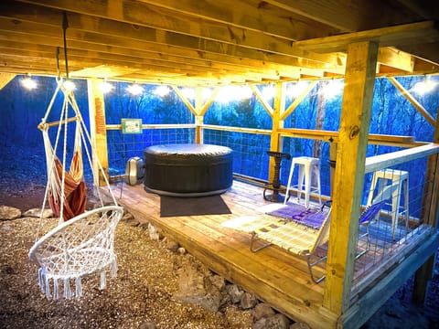 Hot tub/ Bar deck with hammock chairs and vintage jelly loungers