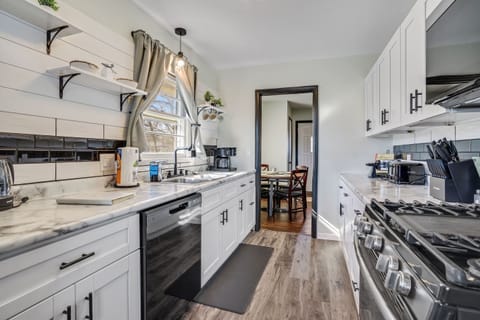 Galley Style kitchen. Recently renovated, featuring Fridge/Freezer, gas range, microwave, dishwasher, double sink and lots of cupboard space