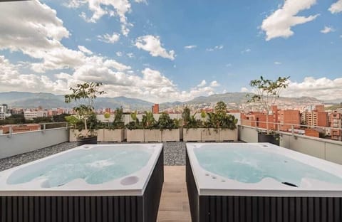 Deluxe Apartment, Balcony, City View | Outdoor spa tub