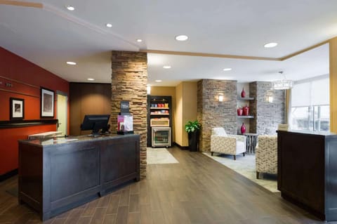 Front desk with stone walls and snack area nearby
