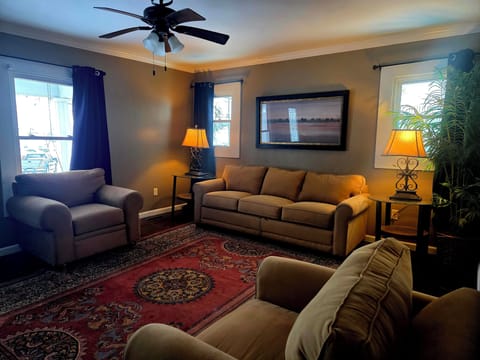 Cozy Living Area with Pull-Out Couch, Matchng Chairs and 65" TV with Roku.
