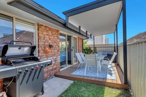 Enjoy relaxed alfresco dining on the covered patio, complete with outdoor seating and a gas BBQ for easy coastal evenings.
