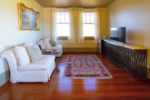 Unit A - Bedroom 6 with king bed, deck, Smart TV, and ensuite 