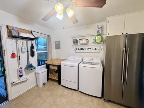 Kitchen Area with full size refrigerator / freezer & washer / drier.