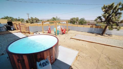 The backyard has everything you need to have a good time! Hot tub, fire pit with Adirondack chairs & swinging hammocks, bocce ball and a propane BBQ!