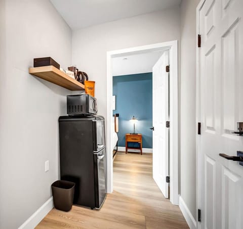 Your hallway getaway for snacks and drinks—fridge, microwave, and coffee maker ready for you!