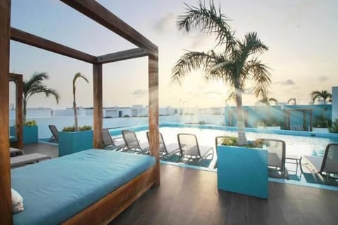 Rooftop pool and daybed; ultimate relaxation.