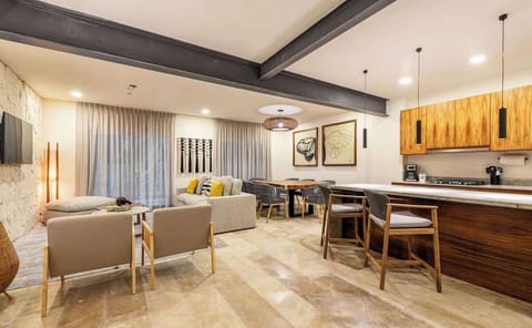 The kitchen area is connected to the living room and dining area, allowing you not to miss a moment