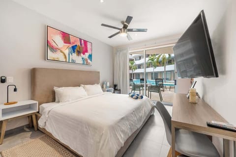 Wake up steps from the pool in this cozy queen bedroom with smart TV.
