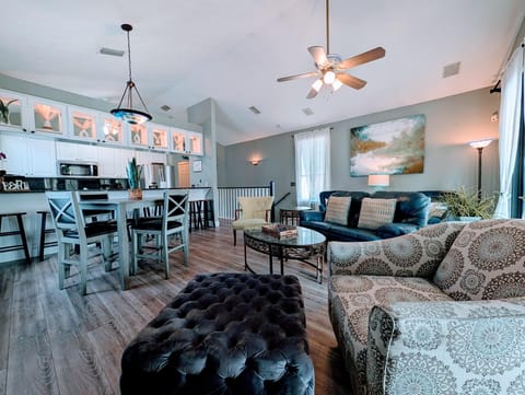 Spacious open-concept living and dining area with cozy seating