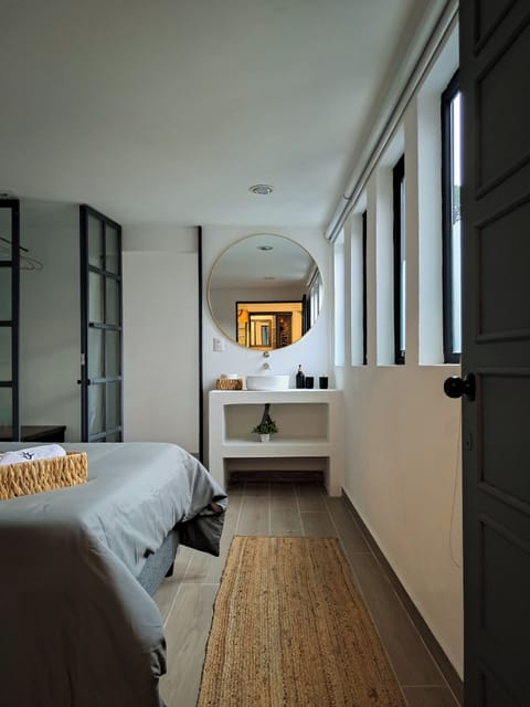 Deluxe Quadruple Room, Courtyard View | Down comforters, minibar, blackout drapes, soundproofing