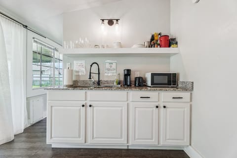 This stylish and functional kitchen is equipped with everything you need to cook, reheat, or just grab a quick cup of coffee.