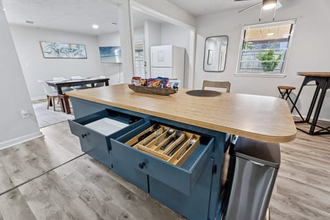 Fully stocked kitchen! Plates, bowls, mugs, pots, pans, spices, and cleaning supplies—ready to make your stay seamless and self-sufficient.