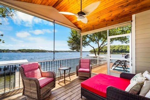 Relax in style on this cozy lakeside porch, complete with comfy seating, warm wood ceilings, and stunning waterfront views. It’s the perfect spot for morning coffee, sunset lounging, and savoring the peaceful lake breeze.