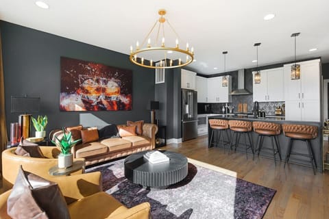 Spacious, stylish living room with a smart TV, sofa, fireplace and comfortable new furnishings for you to relax. Curl up and enjoy the fireplace while looking out at an incredible view of the city!