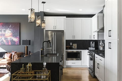 Open floor plan from the kitchen to living room, equipped with comfortable furnishings and all the kitchen essentials you would need. Enjoy the bar cart and additional seating for 4 at the kitchen island.