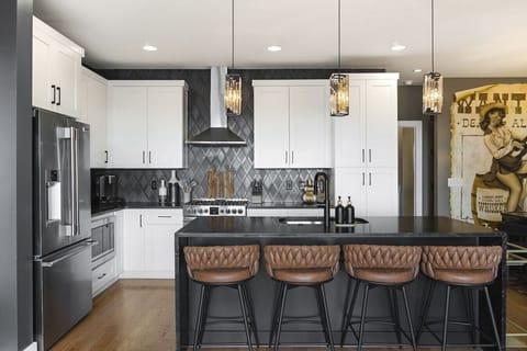 Open floor plan from the kitchen to living room, equipped with comfortable furnishings and all the kitchen essentials you would need. Enjoy the bar cart and additional seating for 4 at the kitchen island.