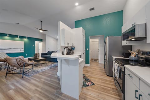 The kitchen blends seamlessly with the living and dining room spaces.