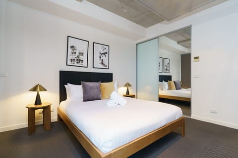 Drift off in a peaceful bedroom featuring a plush bed made up and ready for you.
