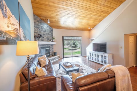Living Area with Fireplace + Vaulted Ceilings